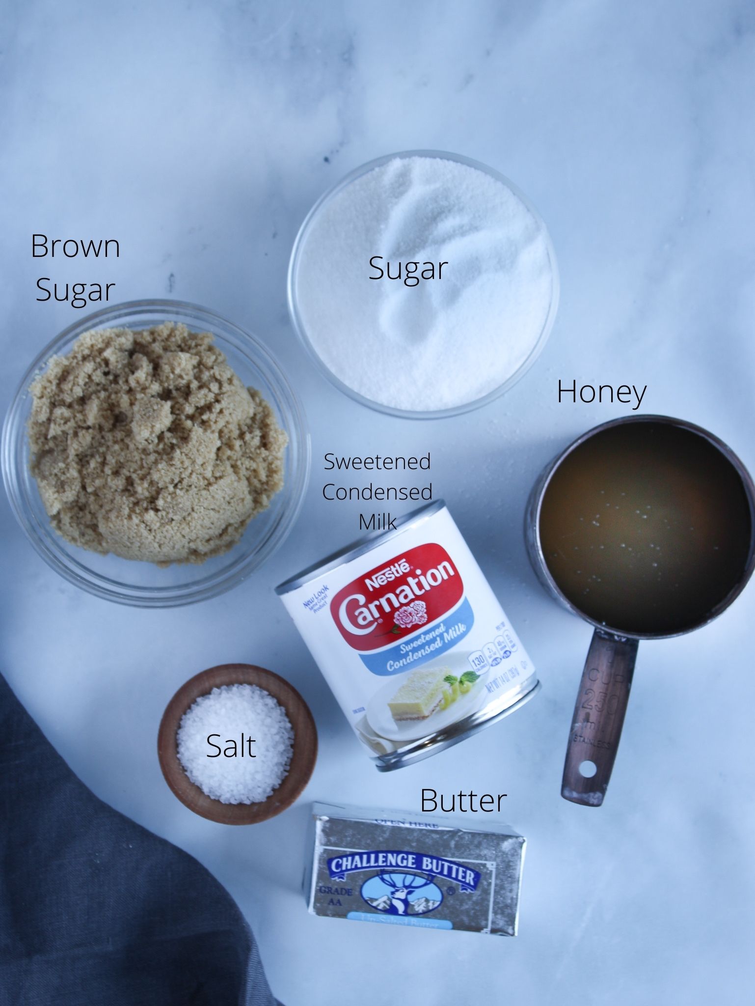Homemade soft caramel candy ingredients sugar, brown sugar, honey, sweetened condensed milk, butter and salt